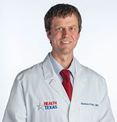 Braxton Fritz, MD in white coat